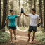 Two runners high-fiving each other on a forest path