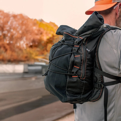 Close-up of the black Adventure Pack 20L worn on the back
