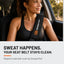 Woman driving with the Orange Mud Seat Belt Wrap on her seat belt